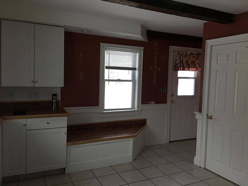 View of front door (Bench seat lifts up for added storage)