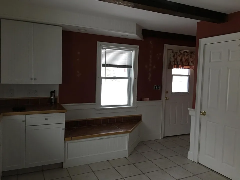 View of front door (Bench seat lifts up for added storage)