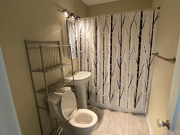 New floor, toilet, sink.
