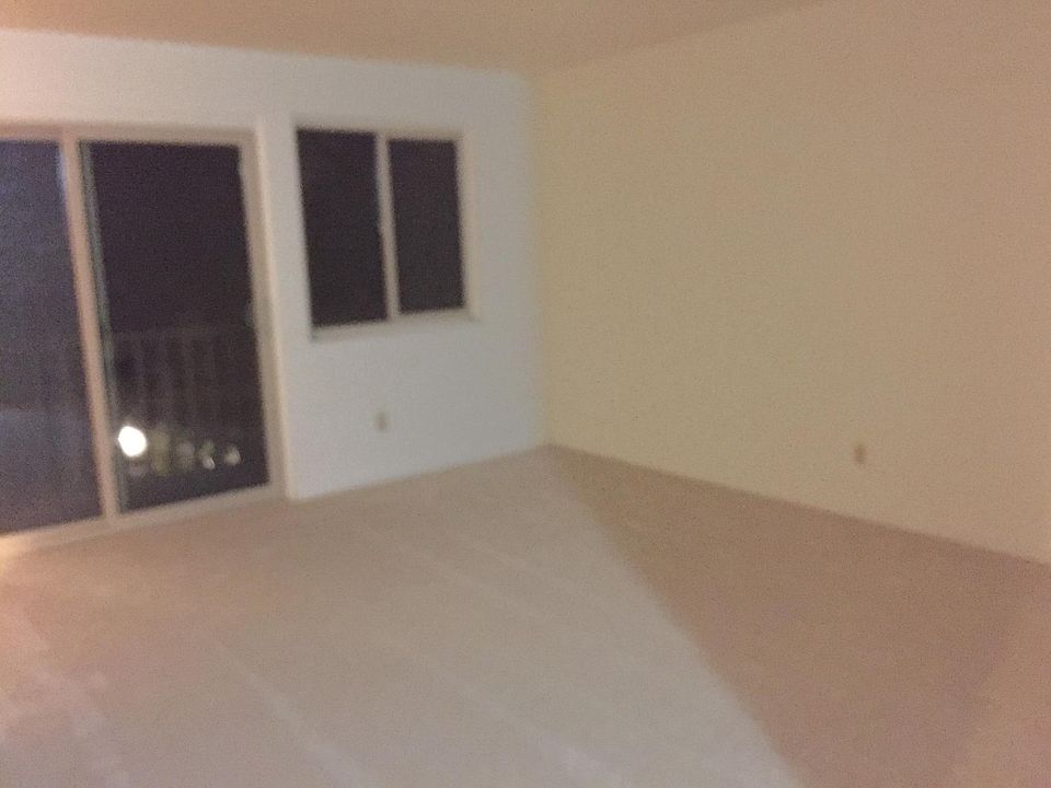 Passing through the front hallway, you step into the living 