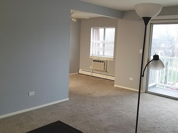 Living Room with balcony and view of Dining Room