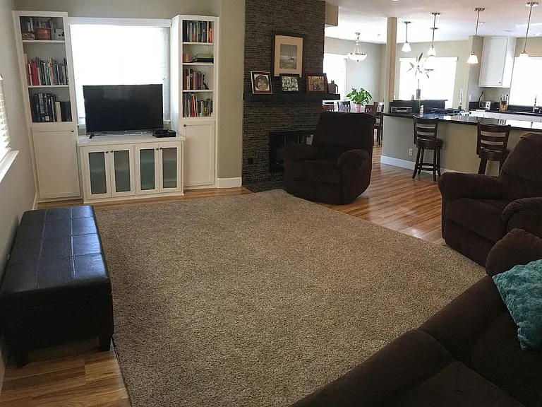 Open space living area, with fireplace.