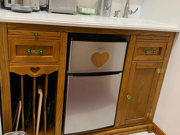 Oak Base cabinet w/Tray Storage, Cutting Board, Silverware Drawer, u/Sink storage, & S/Steel Fridge & Freezer o/natural Carrera Marble Tile floor
