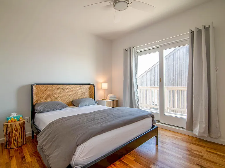 Second story bedroom with deck for viewing pleasure.