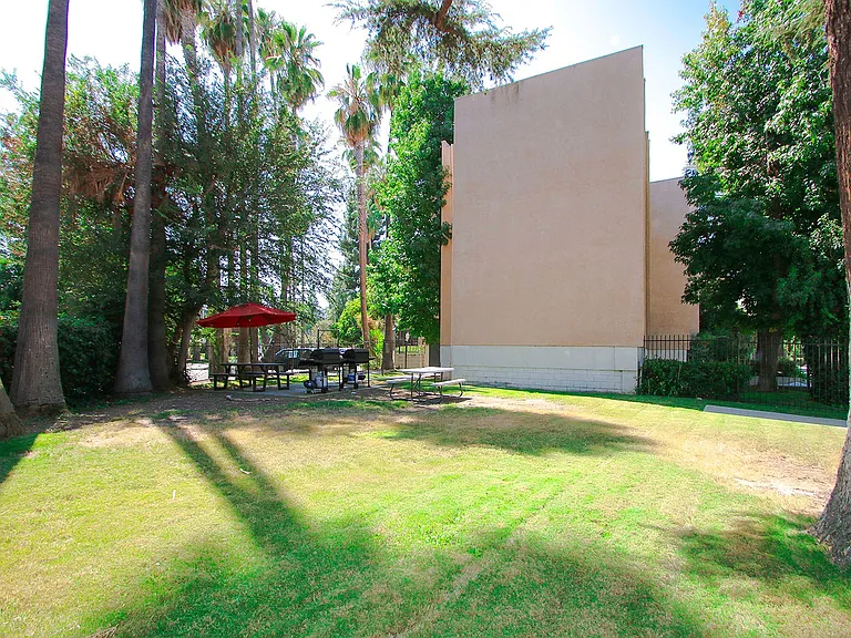 Large private park area surrounding the barbecue space.