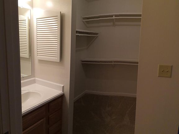 Master bedroom has attached vanity with over sized walk-in c