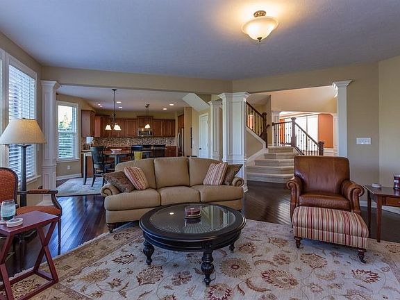 The large family room has hardwoods that stretch into the kitchen, breakfast nook, entry, dining and living room area.