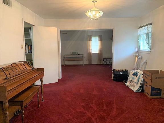 Formal dining between front living area and large flex space