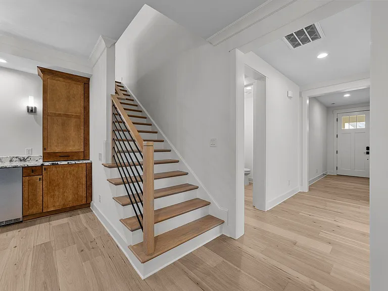 Hardwood stairs leading to the upper level