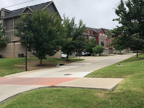 Entrance to subdivision from I-49 access. Unit is on the back side from entrance away from traffic
