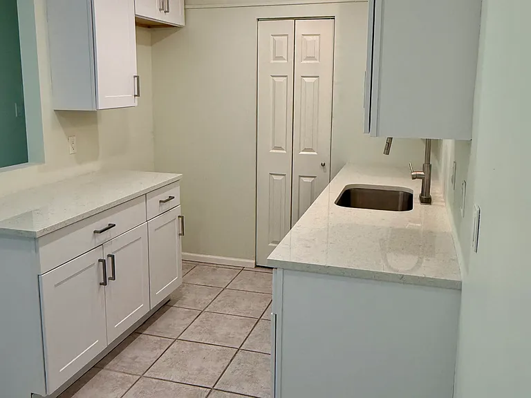 There is a refrigerator, it just had not been installed at the time of photos.