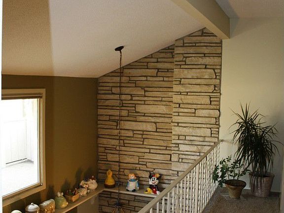 Loft area upstairs is open to living room below.