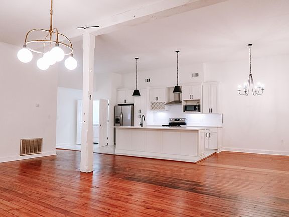 Living area, dining area, and kitchen