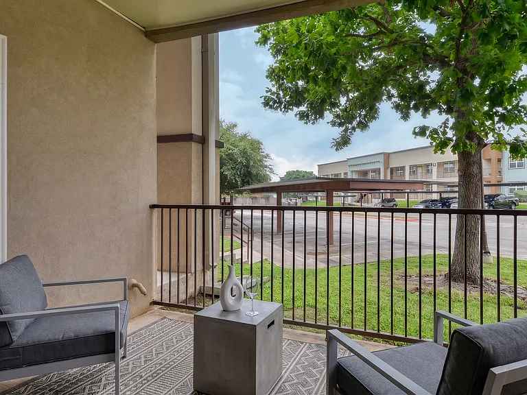 Relax in your private patio with extra storage room!