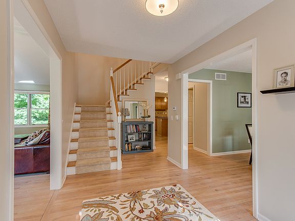 The bright and welcoming foyer showcases the gorgeous wood floors that flow throughout most of the main floor.