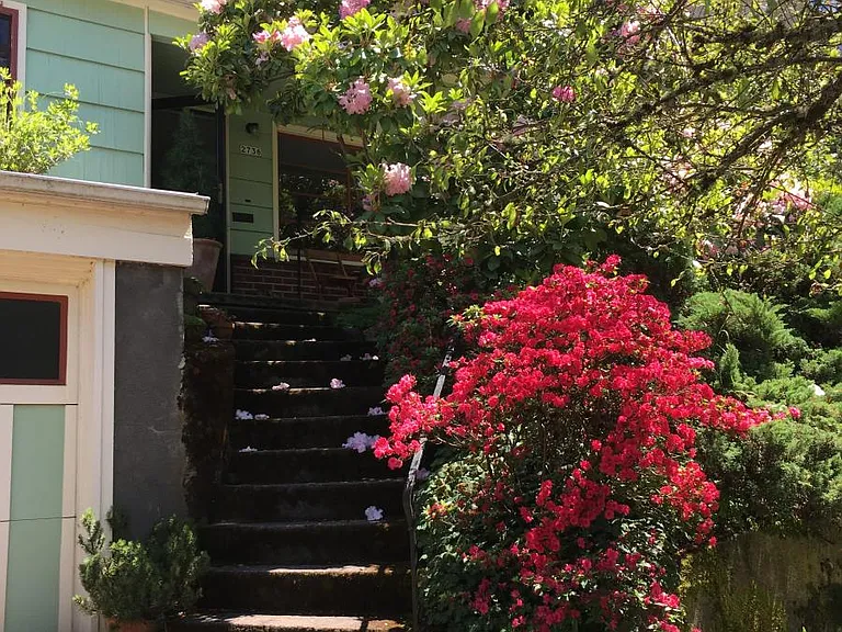 Front steps, corner of garage