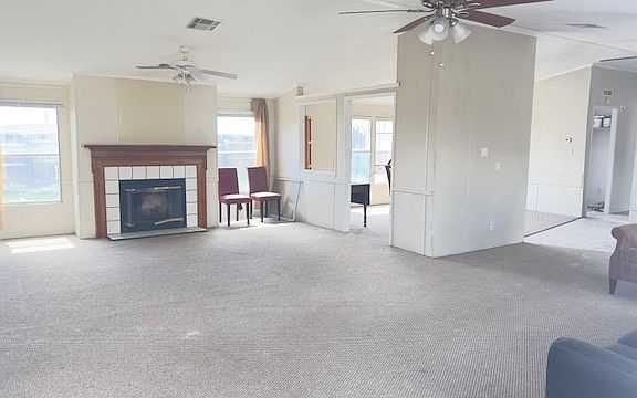 Bright and sunny spacious living area. Skylights were recently removed when new roof was put on.