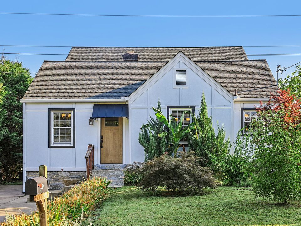 Charming 3-bedroom, 3-bath home in the heart of Green Hills, Nashville. Enjoy a spacious front yard with mature landscaping, off-street parking, and a welcoming entry.