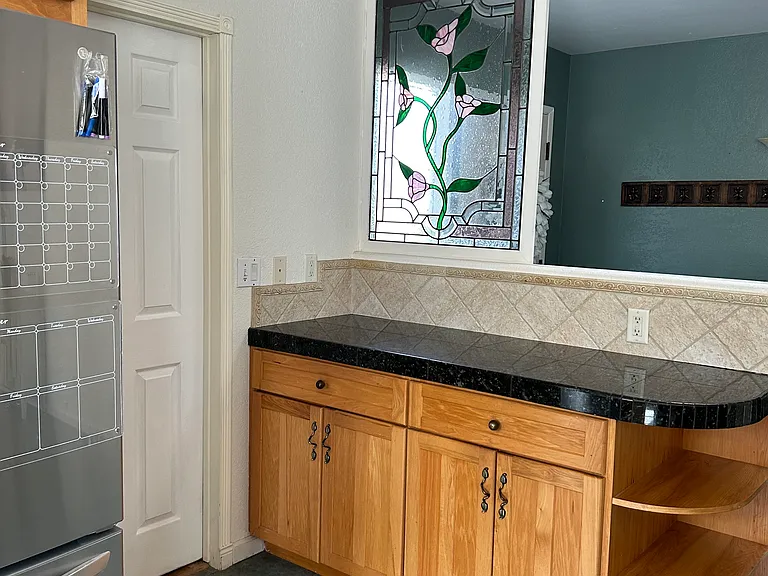 Kitchen into the two car garage and washer & dryer.