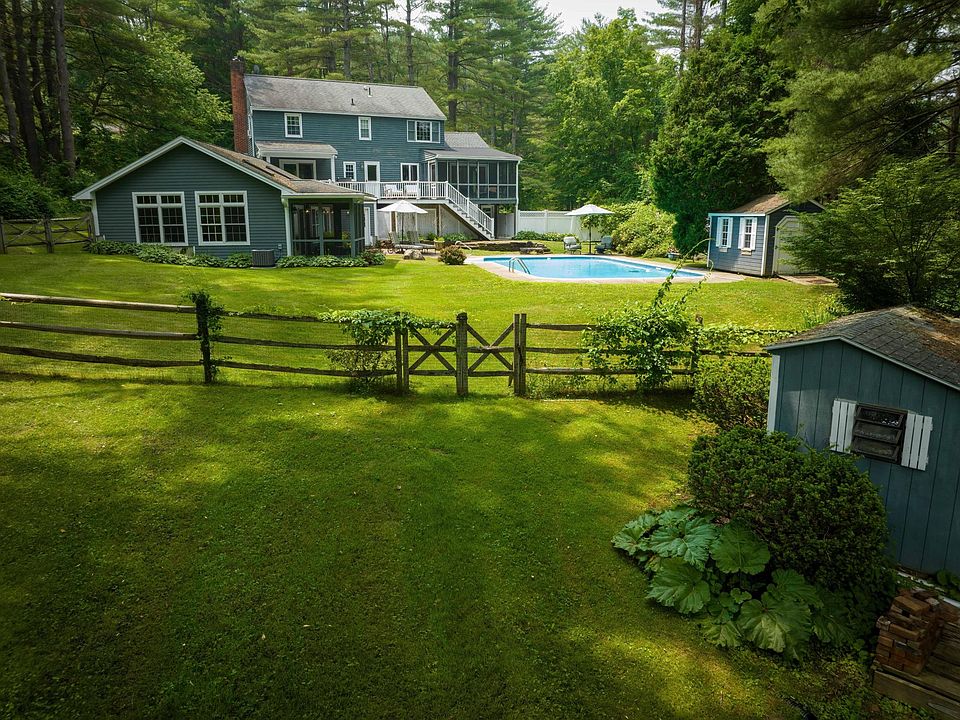From the large back yard you can see the tall windows of the guest house.