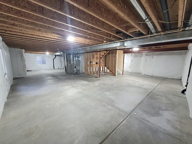 unfinished basement for exercise room, storage, play room, hobby room