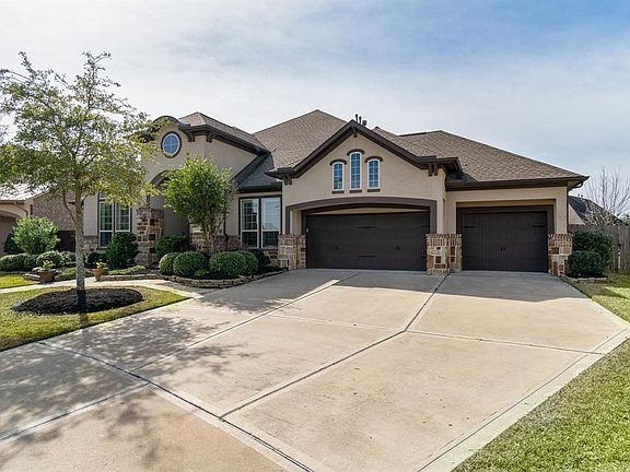Property offers stunning curb appeal with its stone & stucco exterior and a much sought after 3-car wide garage w/driveway provides ample parking for all that gather here!