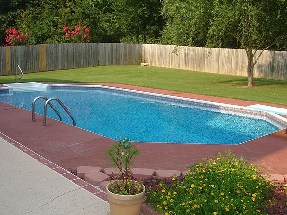 Pool and portion of large back yard
