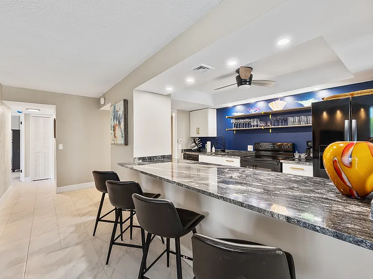 Fully stocked kitchen with cookware, plates, utensils, and all your dining essentials _ plus a refrigerator with built-in ice maker and water filter.