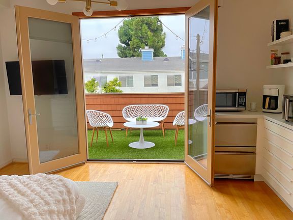 French doors open to private outdoor living room