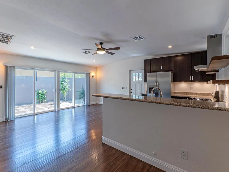 Designer lighting with sconces in the living room and master.