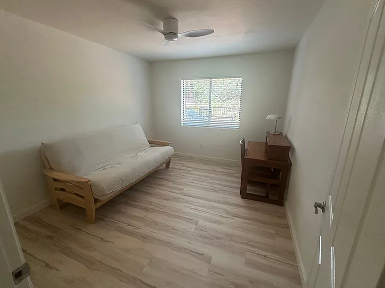 Office with queen size futon and small desk. new, quiet ceiling fan. New luxury vinyl flooring and fresh paint.
