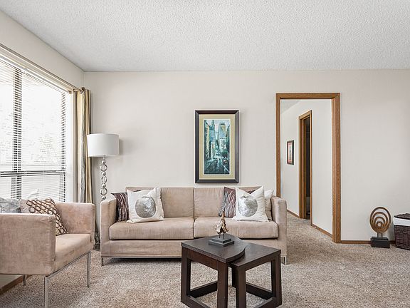Spacious Living Room with Large Windows - Heritage Park Apartments