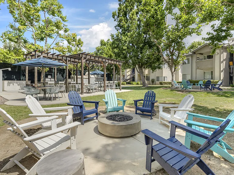 The fire pit at The Summit is conveniently located close to the grills, playground, and seating areas, making it the perfect central spot for gatherings and relaxing with neighbors.