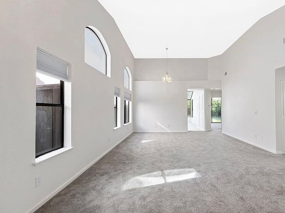 Open-concept living room with stunning vaulted ceilings.