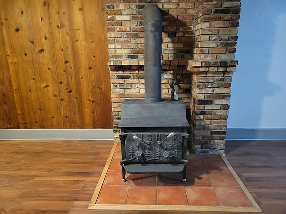 Large wood stove and natural brick hearth can heat entire home!