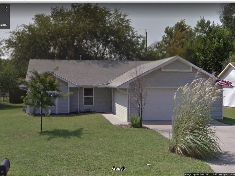 Plant pictured in front of driveway has been removed.