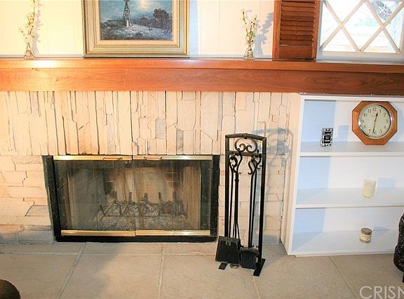 Natural stone fireplace with wood mantle & large hearth!