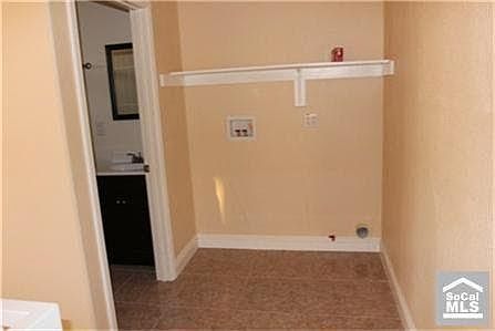 Laundry area out side of upstairs bathroom
