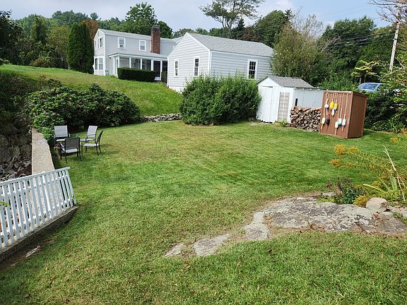 Backyard with fire pit and storage shed