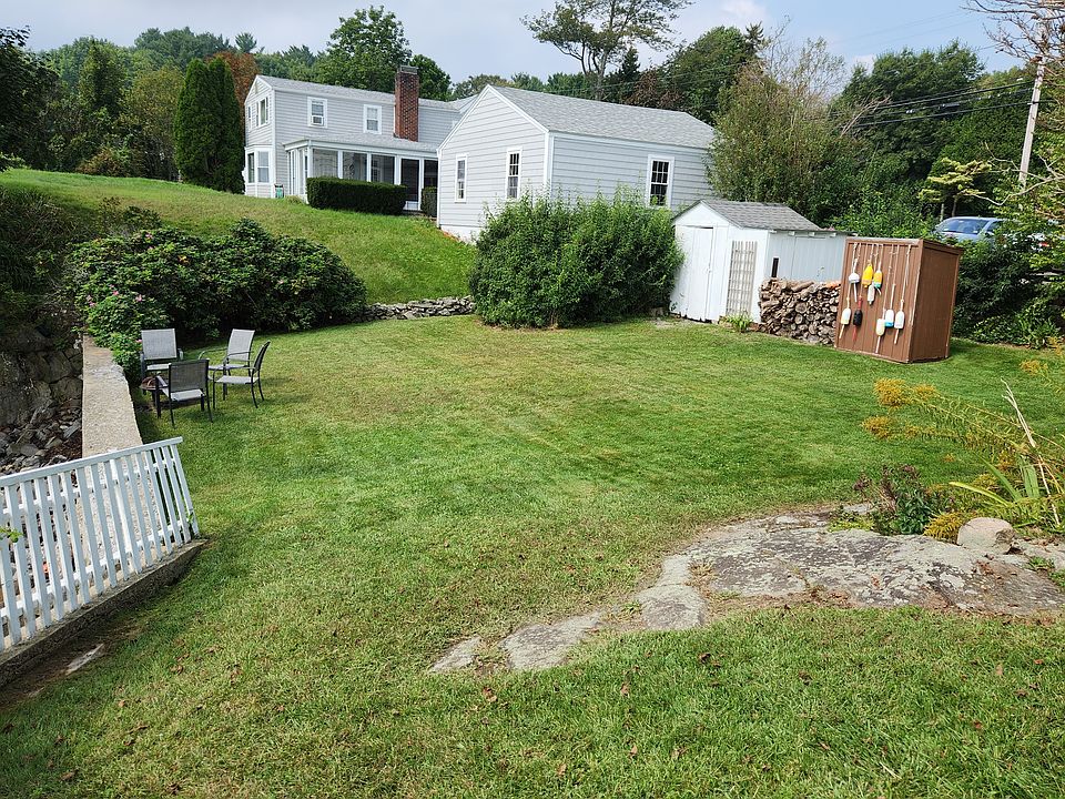 Backyard with fire pit and storage shed