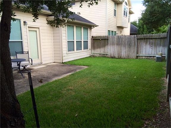 Low maintenance backyard, with sprinkler system, backs to greenbelt.