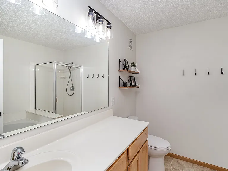 Master bath featuring separate bath and shower