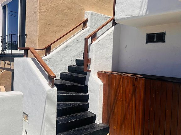 Stairway leading up to the living room