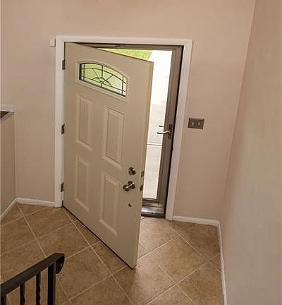 Entry with ceramic tile flooring & updated chandelier