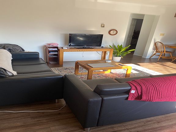 Experience comfort and style in this well-lit living area, perfect for relaxation and entertainment.