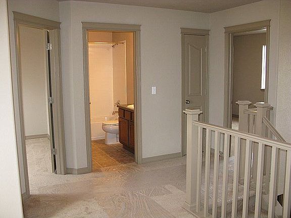 Standing in loft looking towards 2nd and 3rd bedroom/full bath