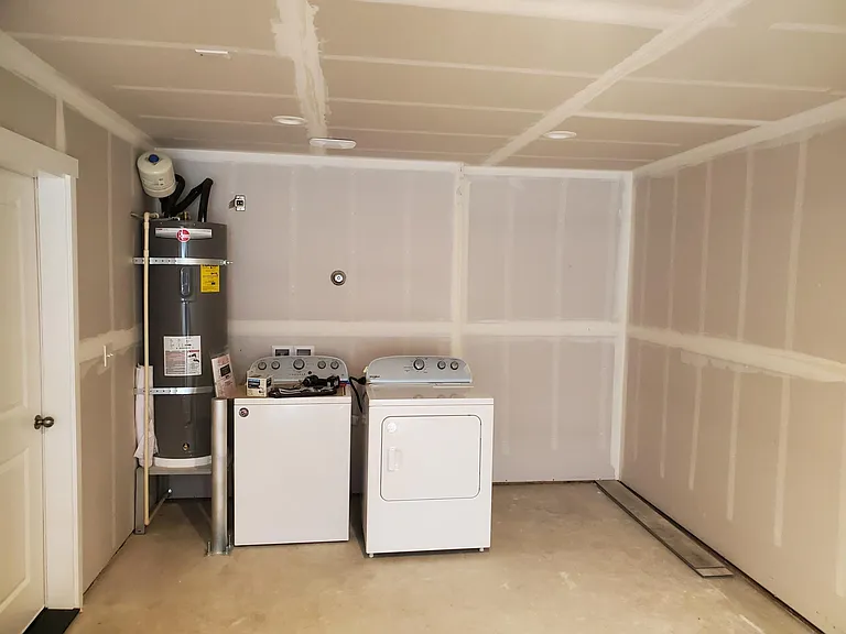 30 ft length in garage with new appliances. If you have appliances, we can remove and hookup yours. Great lighting in the garage and throughout the entire house.