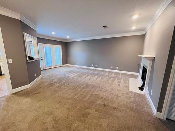 Expansive open floor living area with connected open kitchen