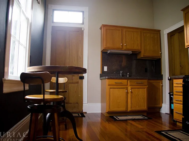 The kitchen leads to the newly built deck at the rear of the house