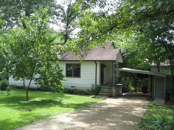 Large yard with carport and workshop